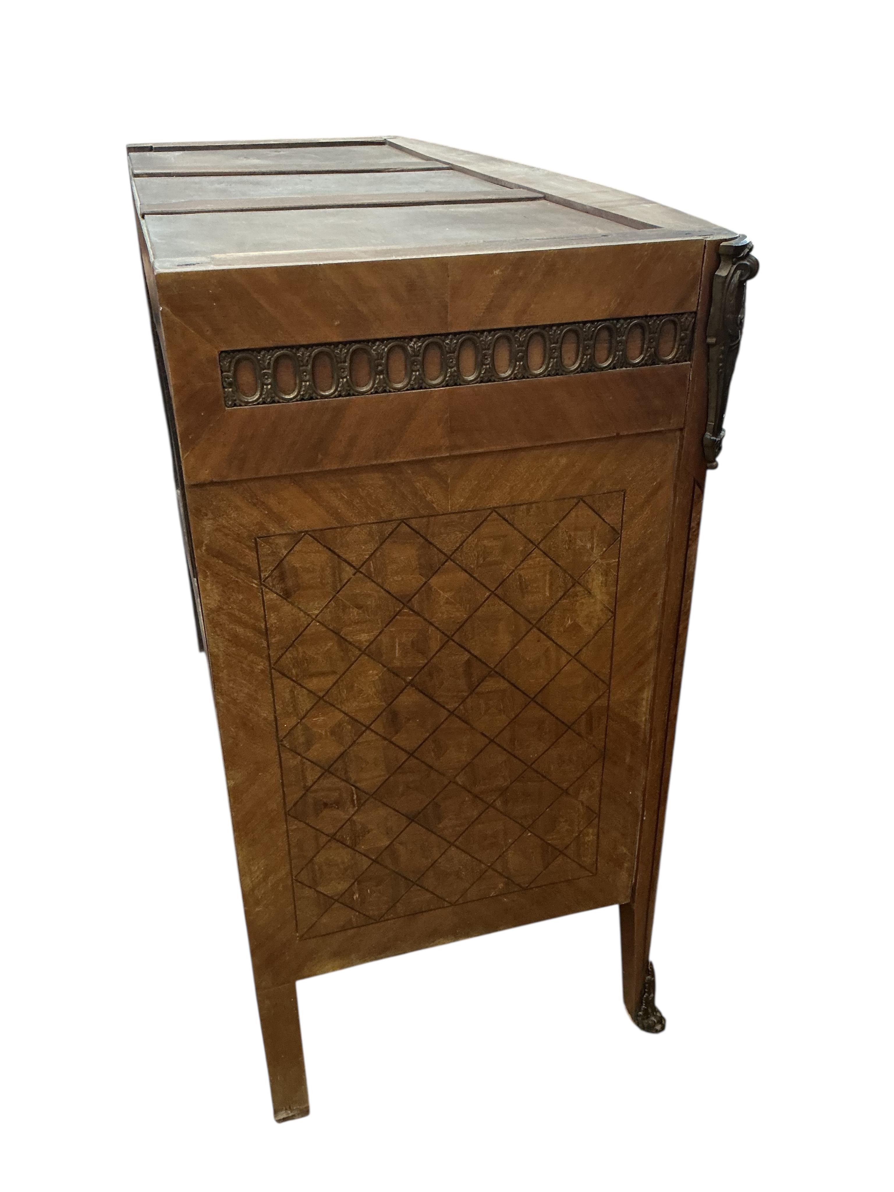 A Louis XVI style marquetry inlaid mahogany commode, lacking marble top, width 122cm, depth 53cm, height 100cm